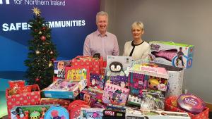 Photo of Prison Fellowship NI Chief Executive Robin Scott being welcomed  to Probation Headquarters by Amanda Stewart Chief Executive as he arrived to collect the food and toys donated by Probation staff