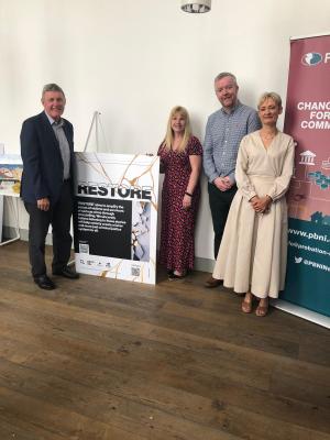 Photo of Probation Board Chair Max Murray, Probation Board Assistant Director Aideen McLaughlin, Chief Executive of Voicing the Void Rory Doherty, and Probation Board Chief Executive Amanda Stewart at the event celebrating the ‘Restore’ project held in the MAC